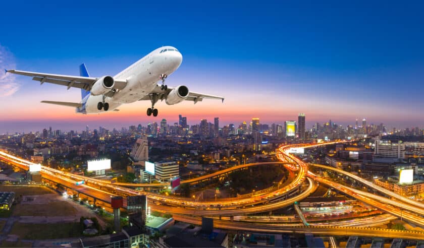 Plane over a city depicting IATA